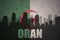 Abstract silhouette of the city with text Oran at the vintage algerian flag
