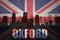 Abstract silhouette of the city with text Oxford at the vintage british flag
