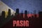Abstract silhouette of the city with text Pasig at the vintage philippines flag