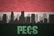 Abstract silhouette of the city with text Pecs at the vintage hungarian flag