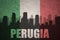 Abstract silhouette of the city with text Perugia at the vintage italian flag