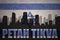 Abstract silhouette of the city with text Petah Tikva at the vintage israel flag