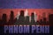 Abstract silhouette of the city with text Phnom Penh at the vintage cambodian flag