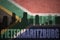 Abstract silhouette of the city with text Pietermaritzburg at the vintage south africa flag