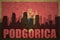 Abstract silhouette of the city with text Podgorica at the vintage montenegro flag