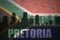 Abstract silhouette of the city with text Pretoria at the vintage south africa flag