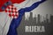 Abstract silhouette of the city with text Rijeka near waving national flag of croatia on a gray background