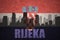 Abstract silhouette of the city with text Rijeka at the vintage croatian flag