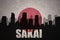 abstract silhouette of the city with text Sakai at the vintage japanese flag