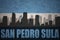 Abstract silhouette of the city with text San Pedro Sula at the vintage honduras flag