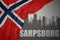 Abstract silhouette of the city with text Sarpsborg near waving national flag of norway on a gray background