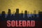 Abstract silhouette of the city with text Soledad at the vintage colombian flag