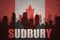 Abstract silhouette of the city with text Sudbury at the vintage canadian flag