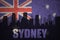 Abstract silhouette of the city with text Sydney at the vintage australian flag
