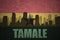 Abstract silhouette of the city with text Tamale at the vintage ghanaian flag