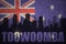 Abstract silhouette of the city with text Toowoomba at the vintage australian flag