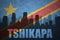 Abstract silhouette of the city with text Tshikapa at the vintage democratic republic of the congo flag