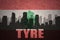 Abstract silhouette of the city with text Tyre at the vintage lebanon flag