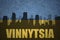 Abstract silhouette of the city with text Vinnytsia at the vintage ukrainian flag