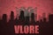 Abstract silhouette of the city with text Vlore at the vintage albanian flag