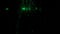 Abstract silhouette of male legs walking through the dark corridor with green glowing particles. Design. A man superhero