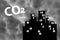 Abstract silhouettes of multi-storey buildings. Smog, smoke or thick fog. Concept - reduction of carbon dioxide CO2 emissions