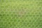 Abstract soccer goal net pattern with green grass
