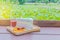 Abstract soft focus cocoa, coffee, rainbow crepe, lemon, grape, on the wooden tray with blurred the lotus plant field, beam light,