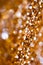 Abstract Spangles golden holidays lights on background