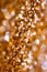 Abstract Spangles golden holidays lights on background