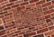 Abstract spiral abstract effect red brick wall texture background pattern. Arch arc mosaic bricks wall Red bricks wall spiral mosa