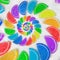 Abstract spiral fruit jelly rainbow wedges slices on white sugar sand background. Rainbow jelliy candies. Sweet fruit jelly liths.