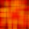 Abstract square multicolored background of blurred vertical and horizontal crossed lines in orange tone