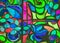 Abstract stained glass background of multicolored glass with floral and fruit ornaments