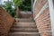 Abstract stairs and brick wall under construction