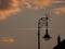 An Abstract of Streetlamp and Bird on a Chimney