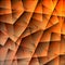 Abstract strict pattern of orange and overlapping triangles and dark irregular shaped lines