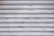 Abstract stripe pattern of white metallic roller shutter doors