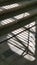 Abstract striped shadows from window lattice