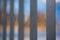 An abstract style shot of black painted palisade fencing with ye