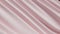 Abstract tenderness pink silk background luxury wave cloth satin pastel color fabric. Luxurious care liquid wave splash