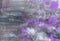 Abstract textural background with gray, violet and blue paint lines with white divorces
