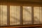 Abstract texture background of indoor vertical window blinds with shadows