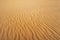Abstract texture. Background with smooth lines of sand. Sand dunes Ripples in the sand