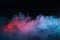 Abstract texture of backlit smoke in red blue on a black background