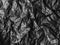 Abstract Texture Crumpled Polyethylene Black Dark Background Pattern Crease Plastic Bag with Sun Shine Backdrop,Film Wrap Grunge,