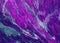 Abstract texture of mixed paints in purple tones. Marble stone texture.