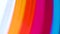 Abstract texture of waving bright colored vertical stripes.