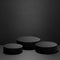 Abstract three black round podiums for cosmetic products with light beams, mockup on black background