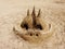 Abstract tower of sand on the beach